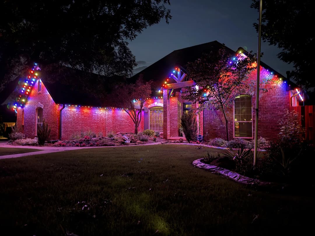Holiday permanent lighting on a courtyard home